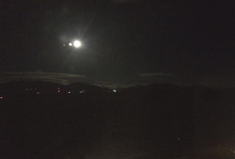 The moon setting over the Rocky Mountains