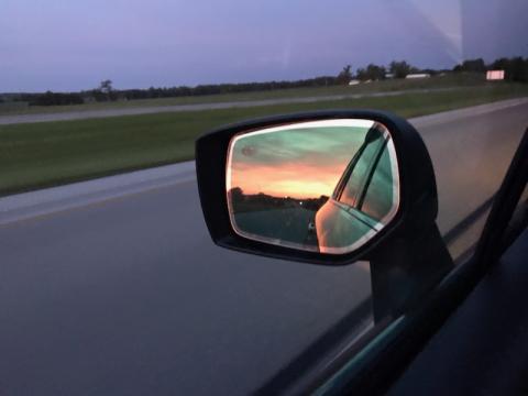 Sunrise in the side view mirror