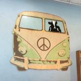 A cow driving an old Volkswagen van