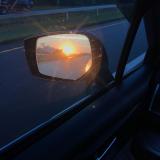 Sunrise in the side view mirror (2018)
