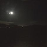 The moon setting over the Rocky Mountains