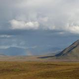 A rainbow over the hill, off the Dalton Highway, Alaska