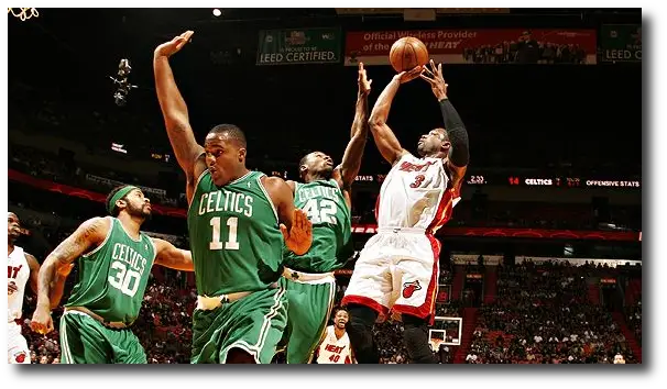 Celtics #11 breaks out into a dance during playoff game with Heat.