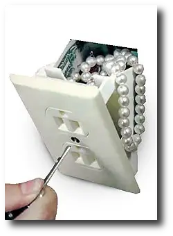 Geek gift ideas for under $10 2009 - Hidden socket wall safe